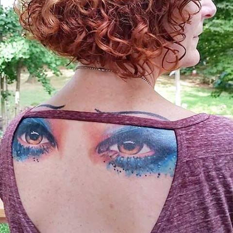 Colored Eyes Tattoos On Girl Upper Back