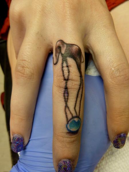 Dali Elephant Tattoo On Girl Middle Finger
