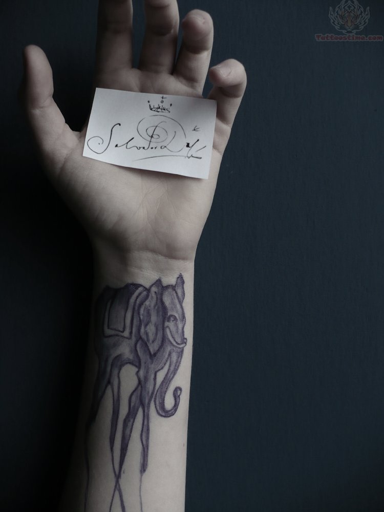 Dali Elephant Tattoo On Left Wrist