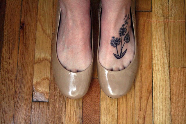 Dandelion Blowing From Puff In Cool Shape Tattoo On Left Foot