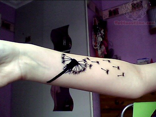Dandelion Blowing From Puff In Deep Black Color Tattoo On Wrist