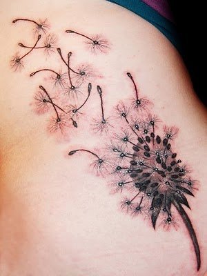 Dandelion Blowing From Puff In Light Red And Black Ink Tattoo On Upper Back