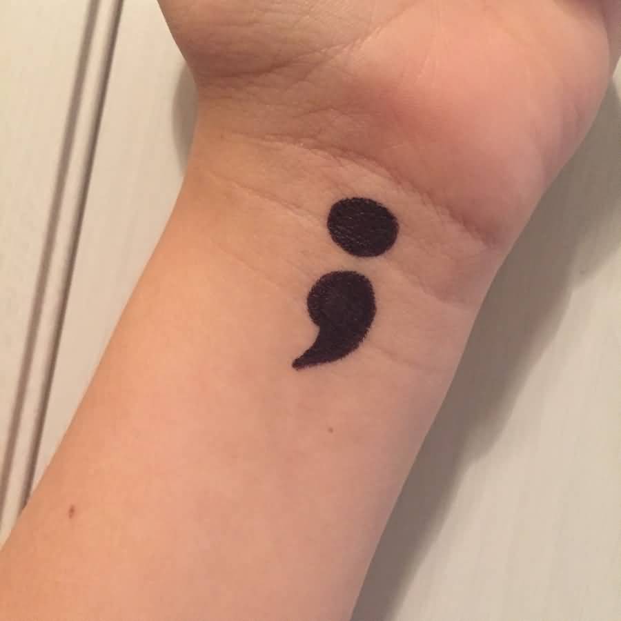 Dark Ink Semicolon Tattoo On Left Wrist