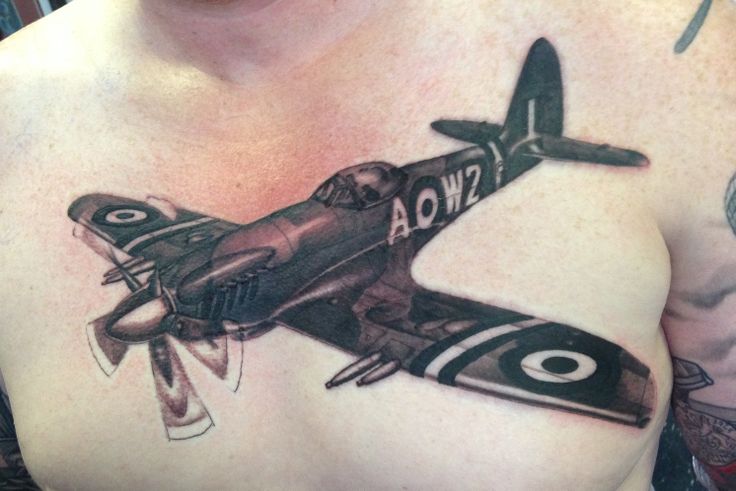 Dark Ink Spitfire Tattoo On Man Chest