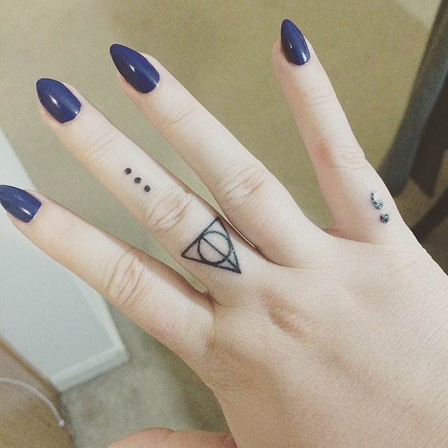 Deathly Hollows And Semicolon Tattoo On Girl Fingers