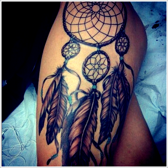 Dreamcatcher Tattoo In Blue And Light Brown Ink On Leg