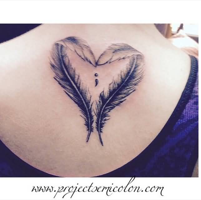 Feathers In Heart Shape And Semicolon Tattoos On Upper Back