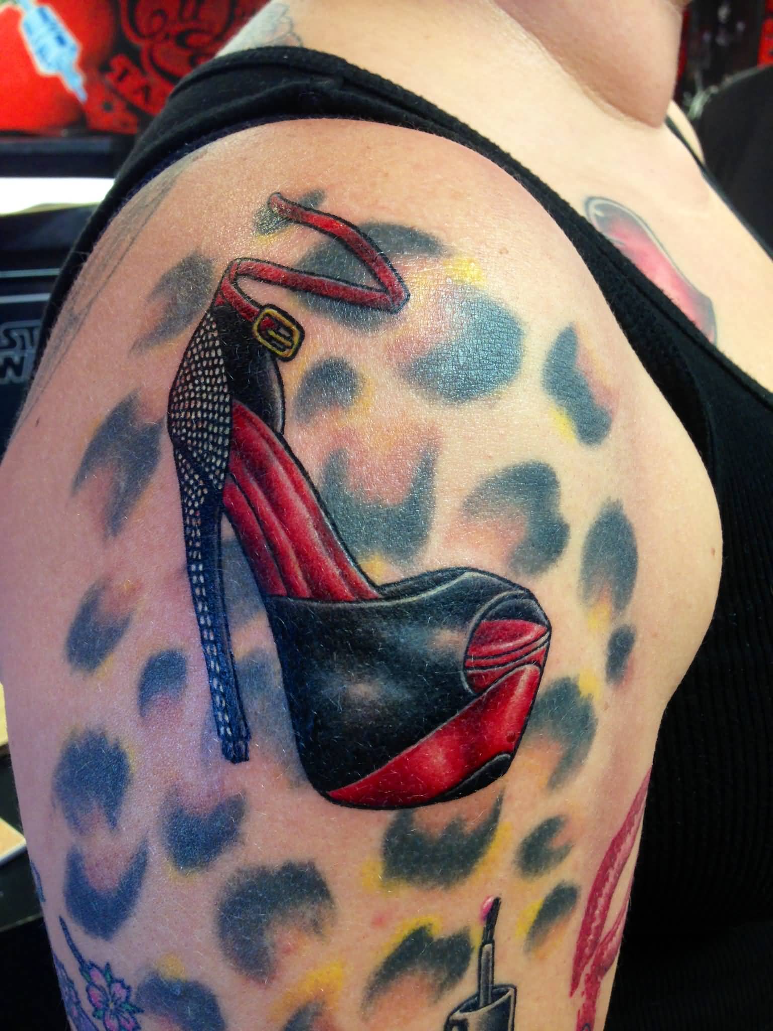Female Shoes Tattoo On Right Shoulder