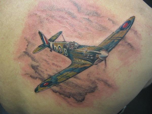 Flying Spitfire Tattoo On Right Back Shoulder
