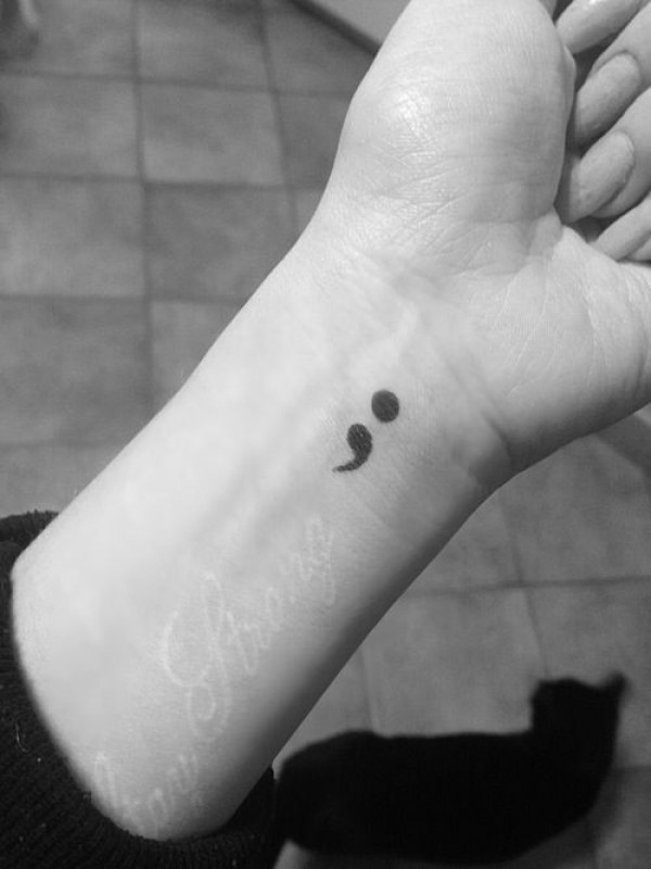 Girl Showing Her Semicolon Tattoo