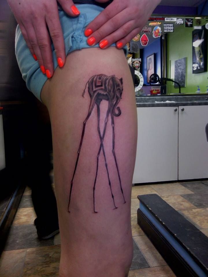 Girl With Dali Elephant Tattoo On Side Thigh