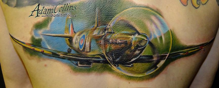 Green Ink Spitfire Tattoo On Back by Adam Collins