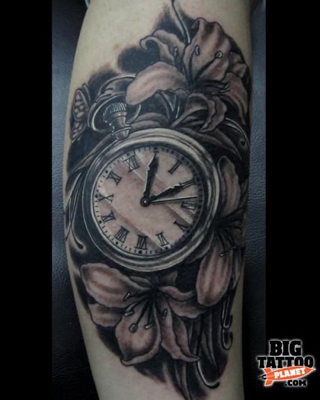 Grey Flowers And Clock Tattoo On Arm