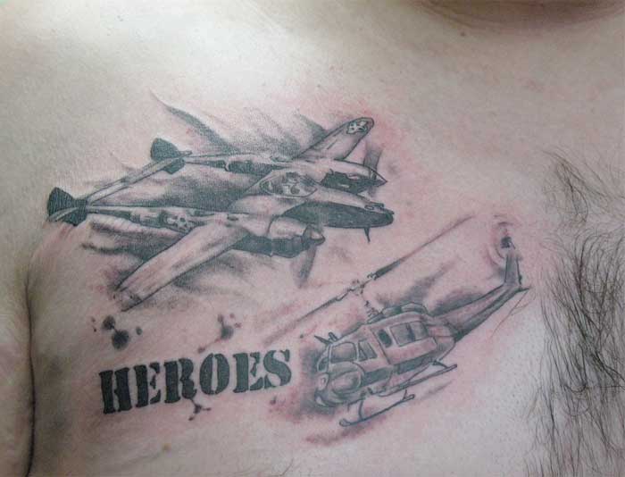 Grey Ink Airplane Spitfire Tattoos On Man Chest