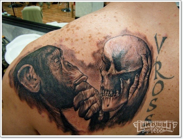 Grey Ink Chimpanzee With Skull In Hand Tattoo On Left Back Shoulder
