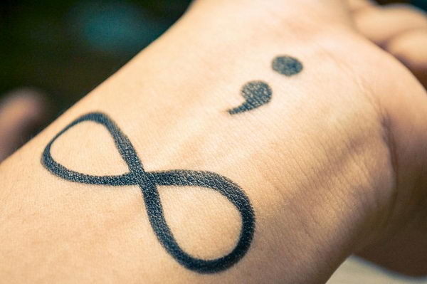 Infinity And Semicolon Tattoo On Left Wrist