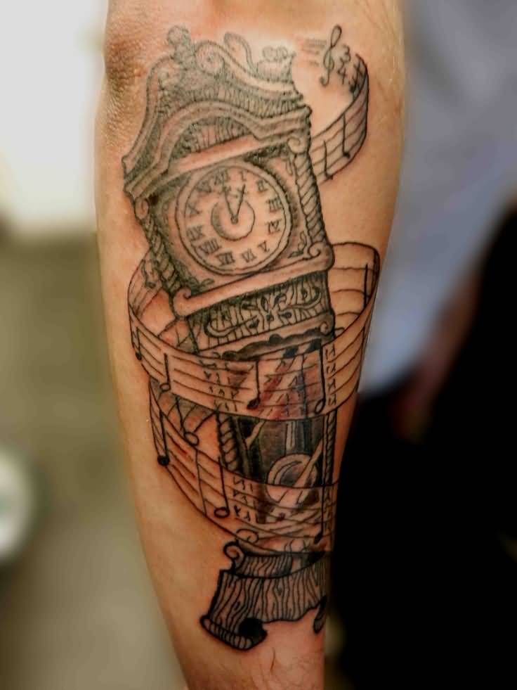 Music Notes And Grandfather Clock Tattoo On Arm