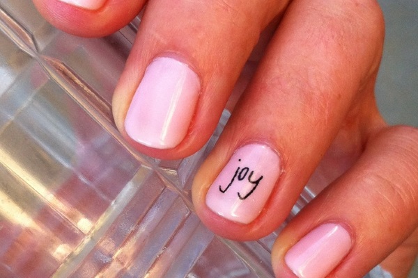 Pink Nails With Joy Text Accent Nail Art
