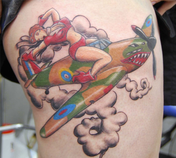 Pinup Girl On Spitfire Tattoo On Side Thigh