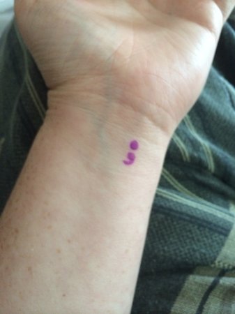Purple Ink Semicolon Tattoo On Left Wrist