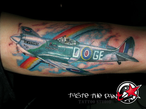 Rainbow And Spitfire Tattoo On Left Sleeve