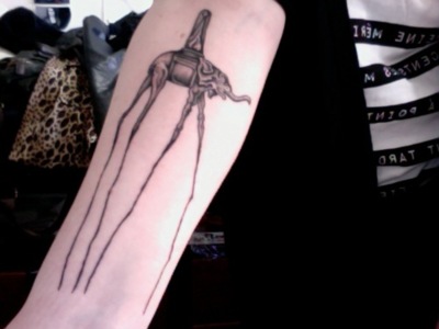 Salvador Dali Elephant Tattoo On Forearm