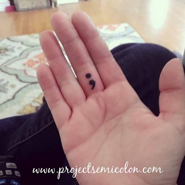 Small Black Semicolon Tattoo On Finger