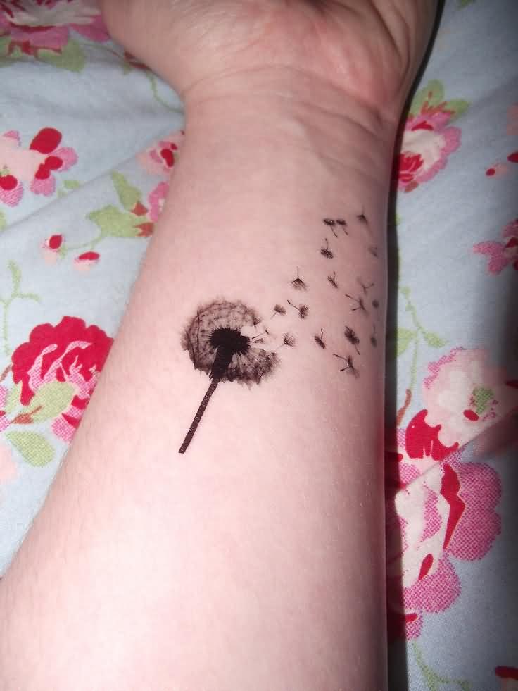 Small Dandelions Blowing From Puff Tattoo On Forearm