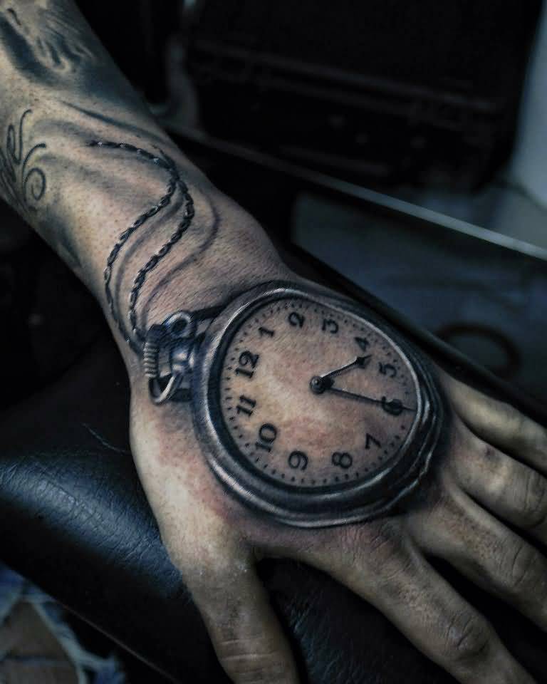 Stunning Clock Tattoo On Left Hand by Yomico Moreno