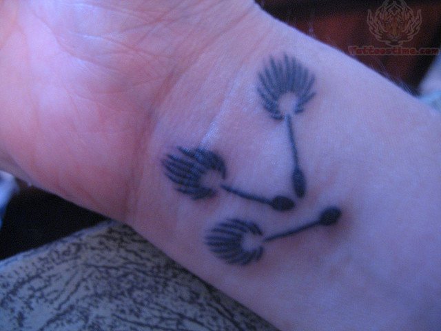 Three Dandelion Puffs In Small Size Tattoo On Wrist