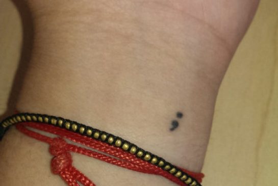 Tiny Semicolon Tattoo On Wrist For Girls