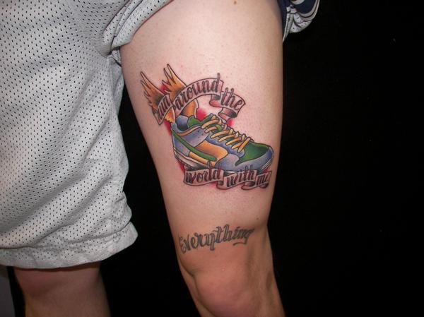 Winged Shoes Tattoo On Left Thigh