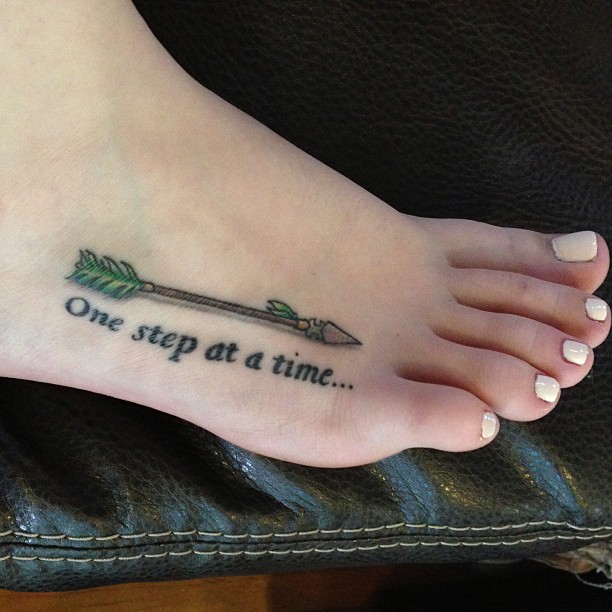 3D Ancient Arrow Tattoo With Lettering Tattoo On Foot