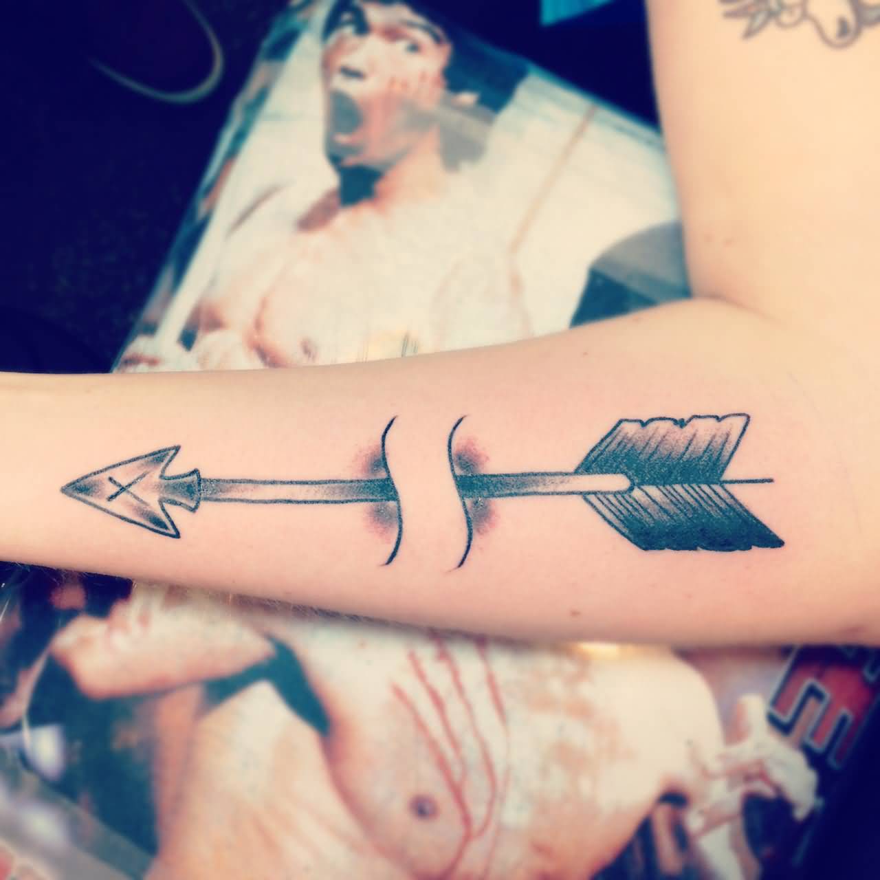 Abstract Arrow  Ripped Skin Tattoo On Forearm