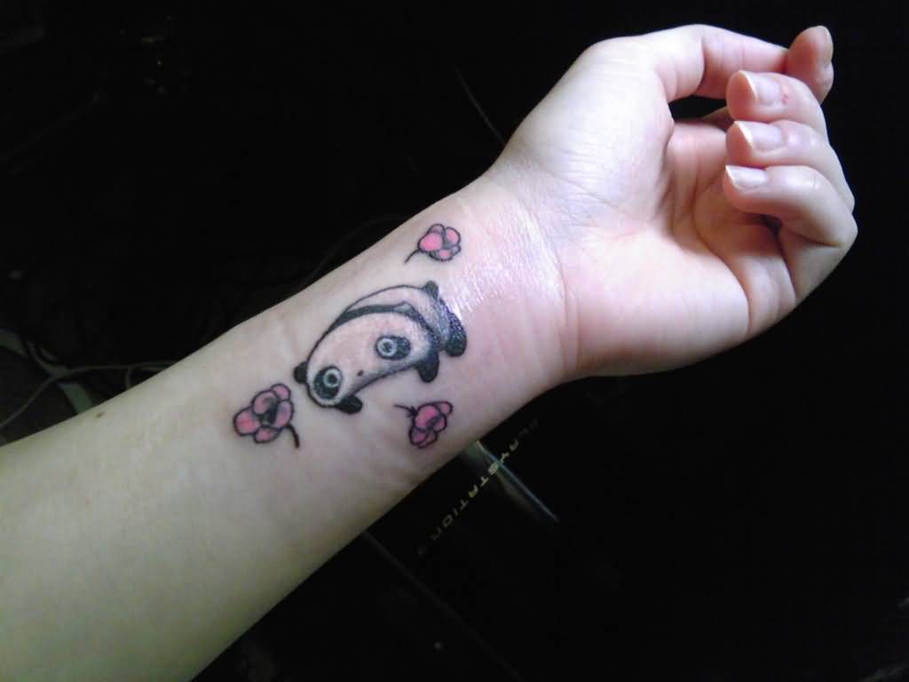 Adorable Baby Panda With Red Flowers Tattoo On Wrist