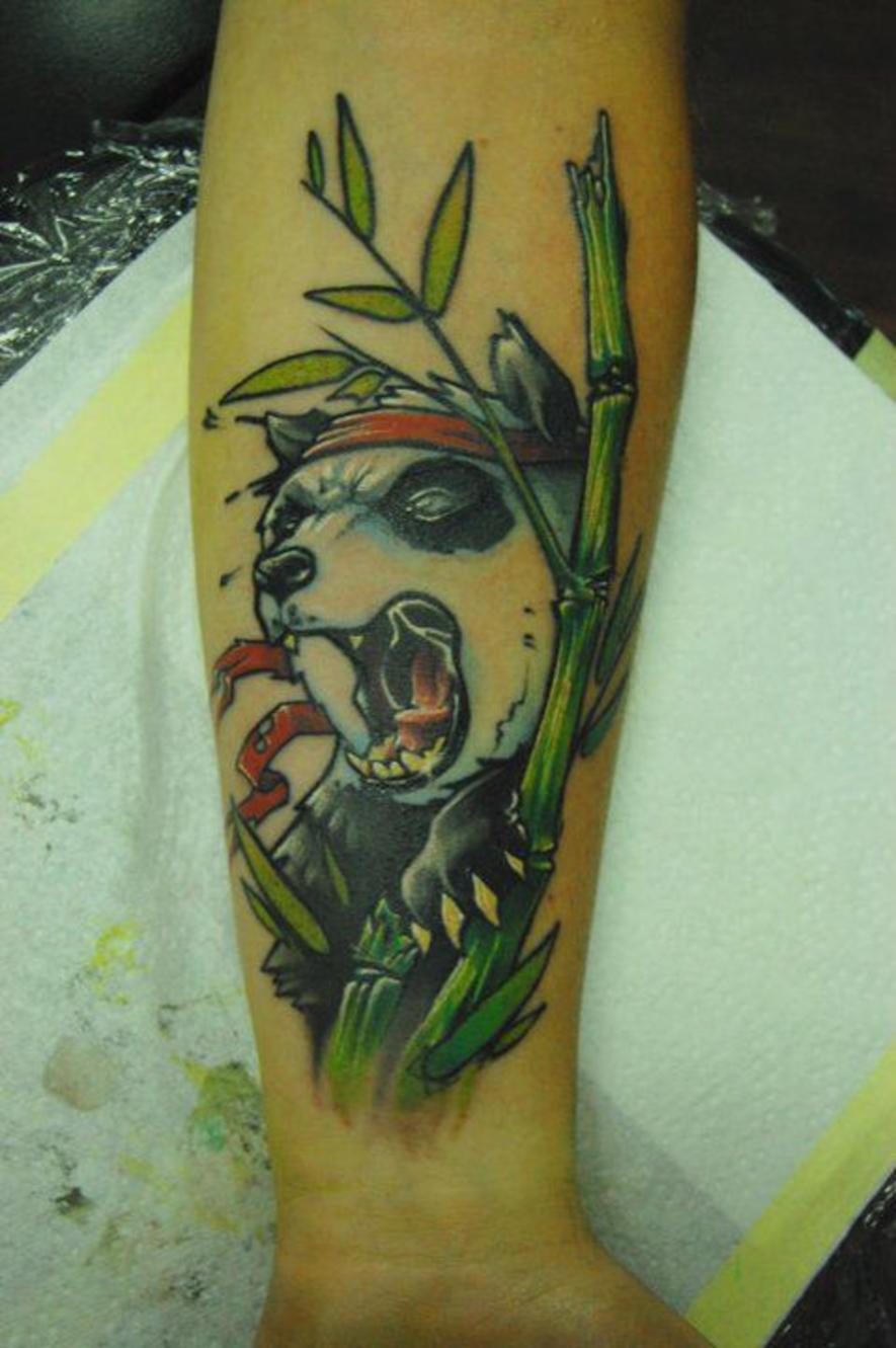 Amazing Screaming Panda With Bamboos Tattoo On Forearm