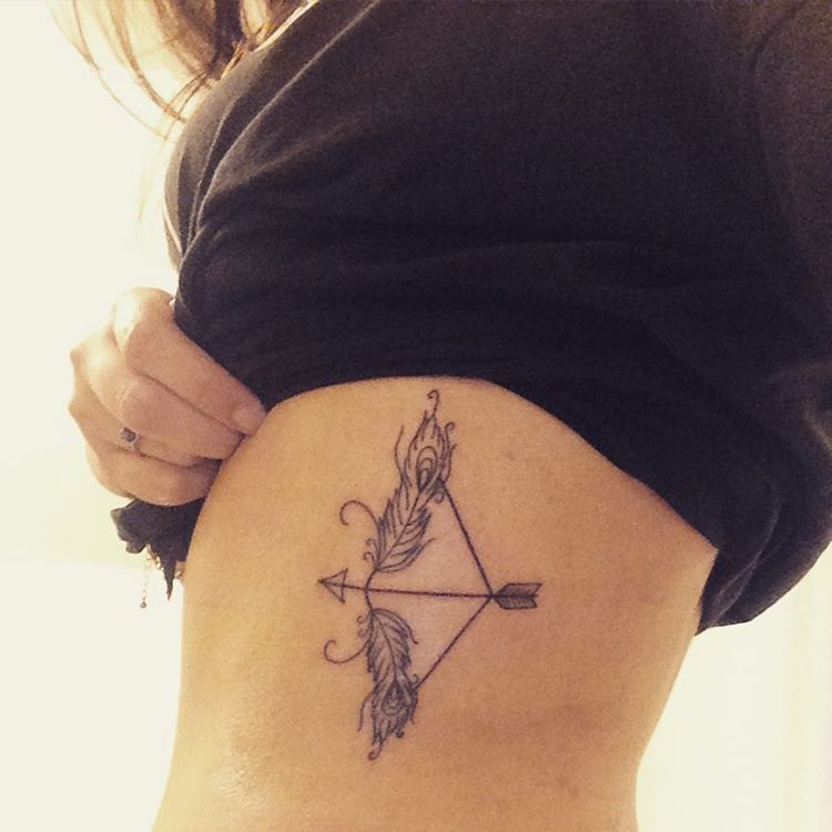 Amazingly Designed Bow And Arrow Tattoo On Rib For Girls