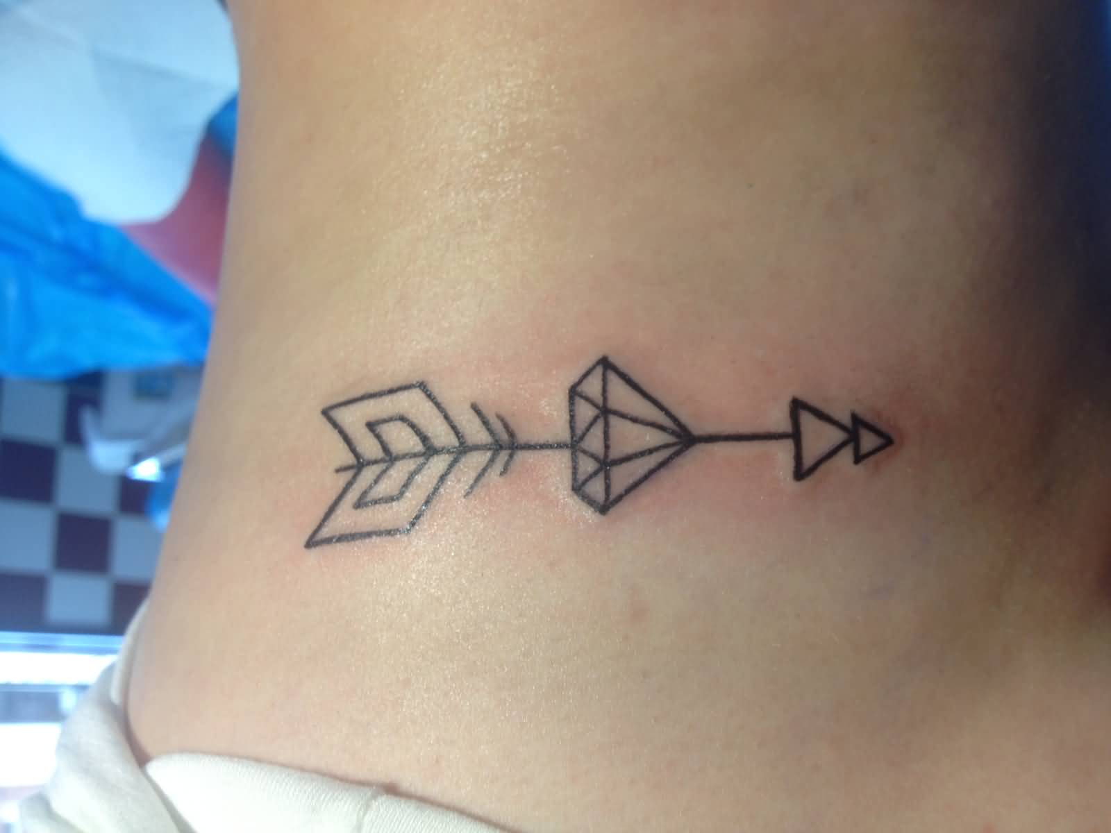 Arrow With Diamond Tattoo On Rib