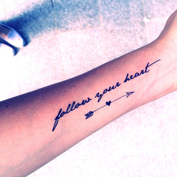 Arrow With Heart And Quote Tattoo On Forearm