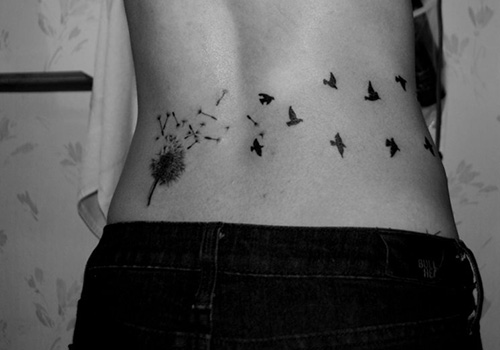 Beautiful Birds Flying From Dandelion Tattoo On Lower Back
