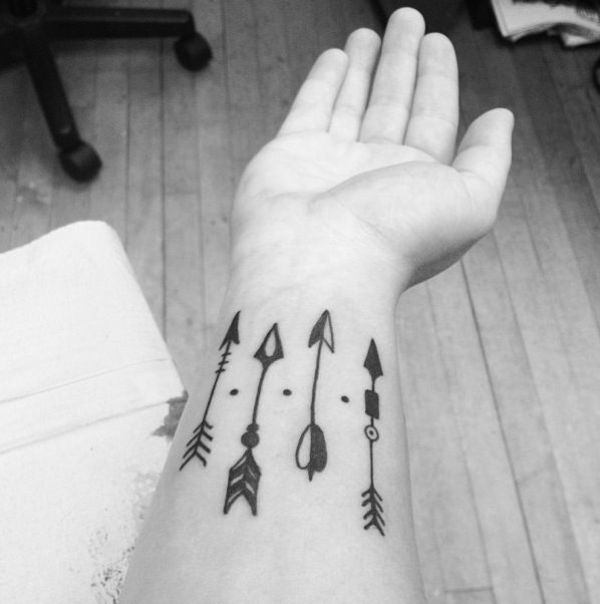 Black And White Arrows Tattoo On Wrist