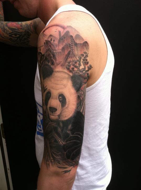 Black And White Panda In Forest Tattoo On Half Sleeve