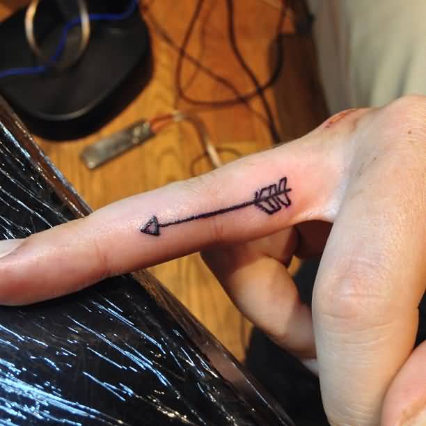 Black Ink Arrow Tattoo On Finger For Women