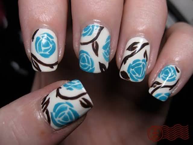 Blue Flowers Nail Art On White Nails
