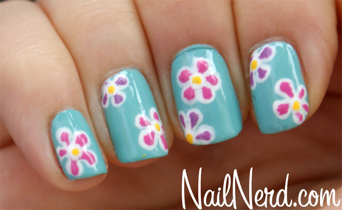 Blue Nails With Pink And Purple Flower Nail Art