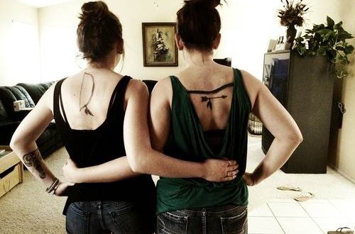 Bow And Arrow On Two Different Back Tattoos