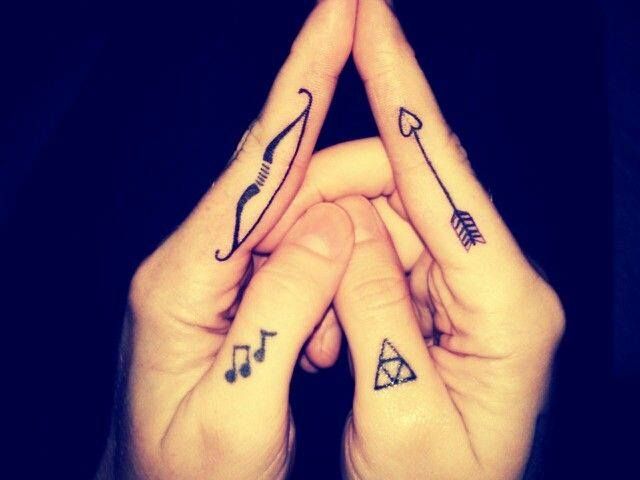 Bow And Heart Headed Arrow With Music Notes And Dead Triangle Tattoo On Fingers