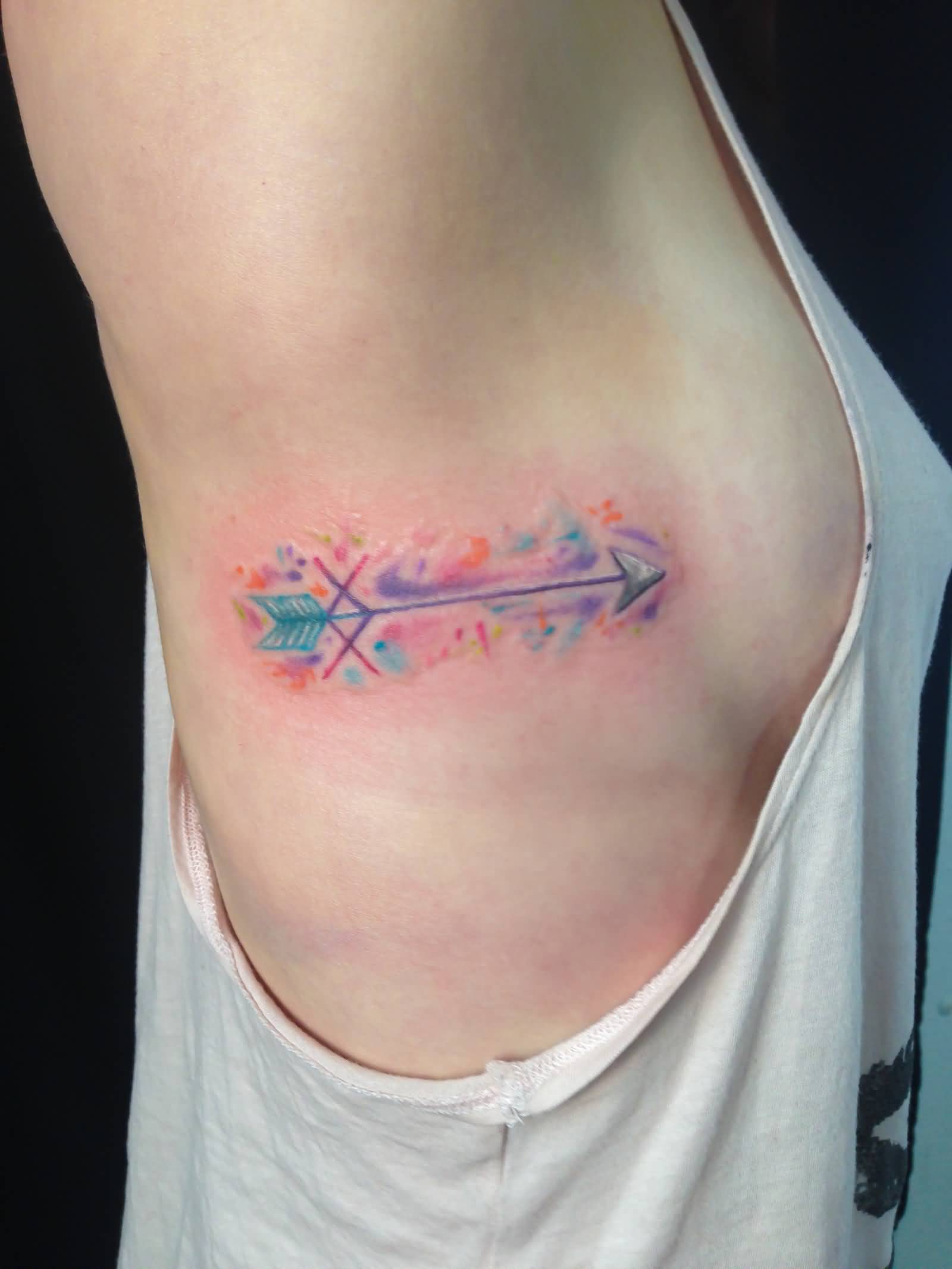 Colorful Arrow Design Tattoo On Rib