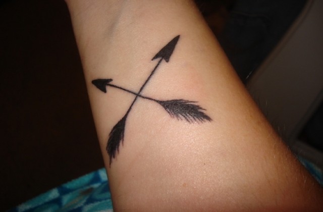 Crossed Arrow Feather Tattoo On Forearm