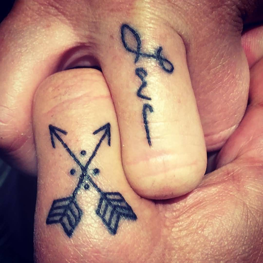 Crossed Black Inked Arrow With Love Tattoo On Fingers